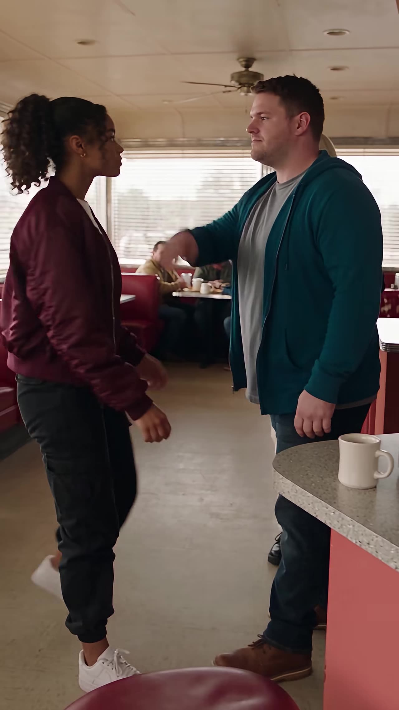 Bully confronts young woman standing up to him in diner