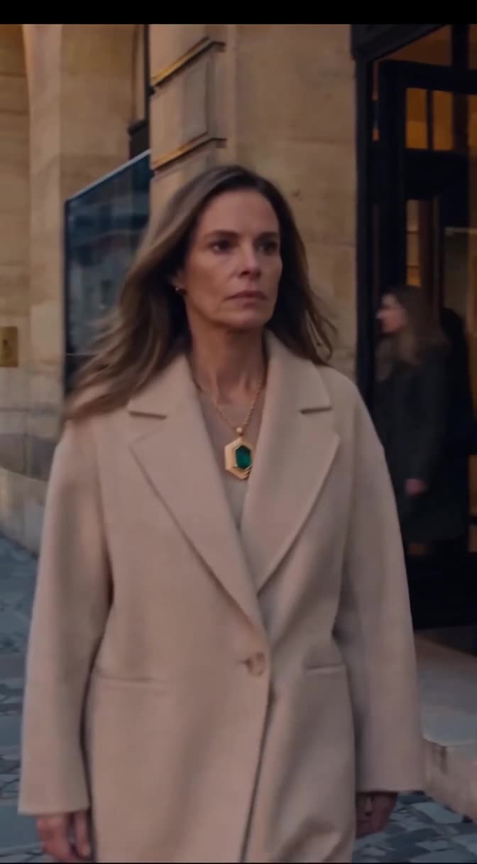 Victoria walks frozen in disbelief on Boulevard Haussmann.