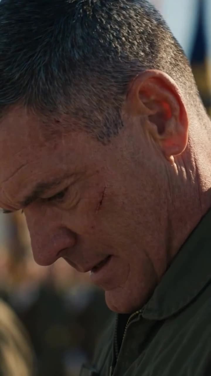Commander Elias Rourke looking down with sudden dread and apologetic submission
