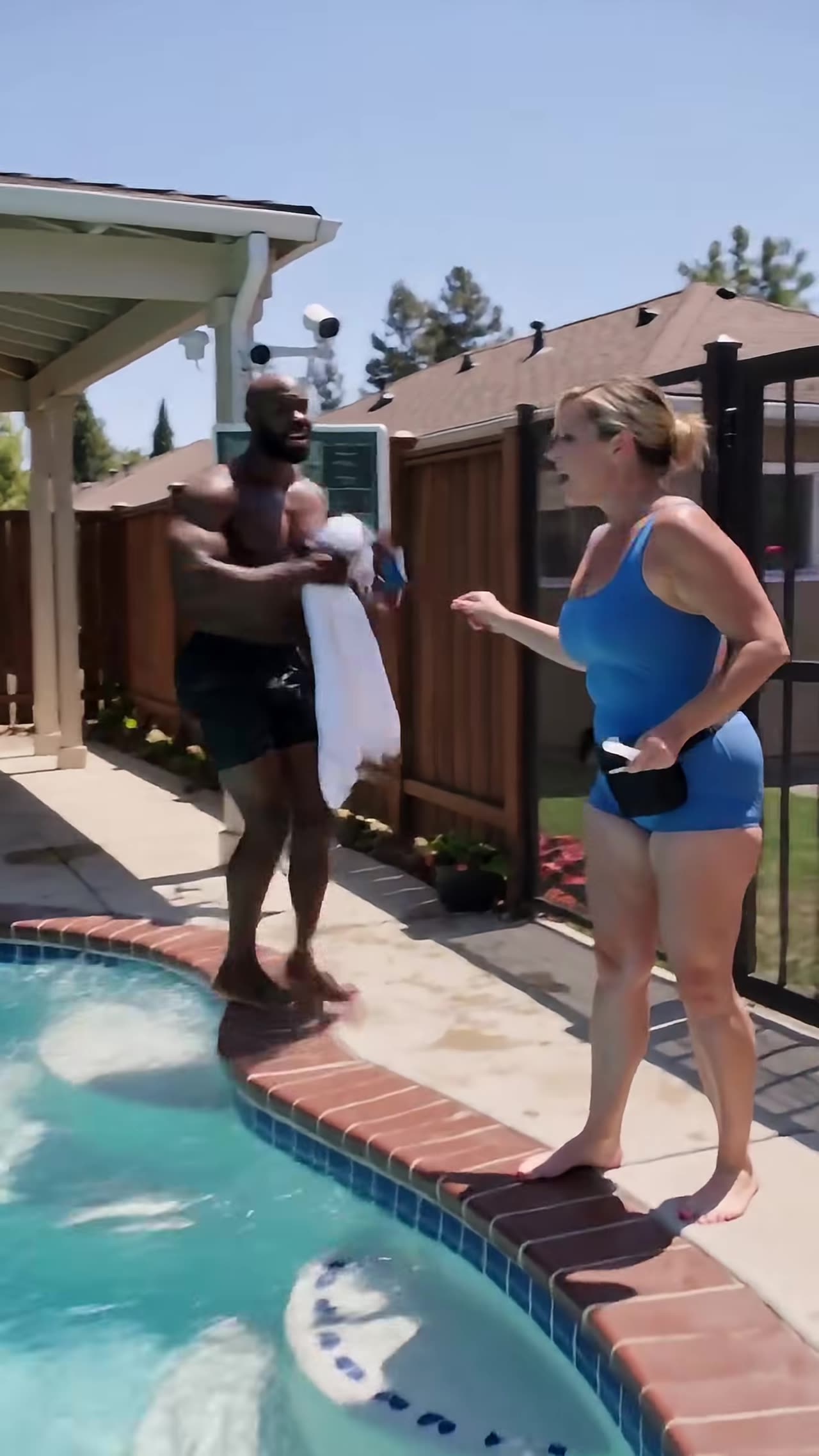 Homeowner out of pool confronting woman face to face by cameras