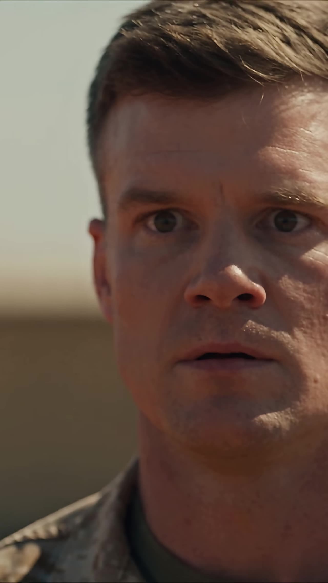 Stunned sergeant with wide eyes frozen after shocking reveal