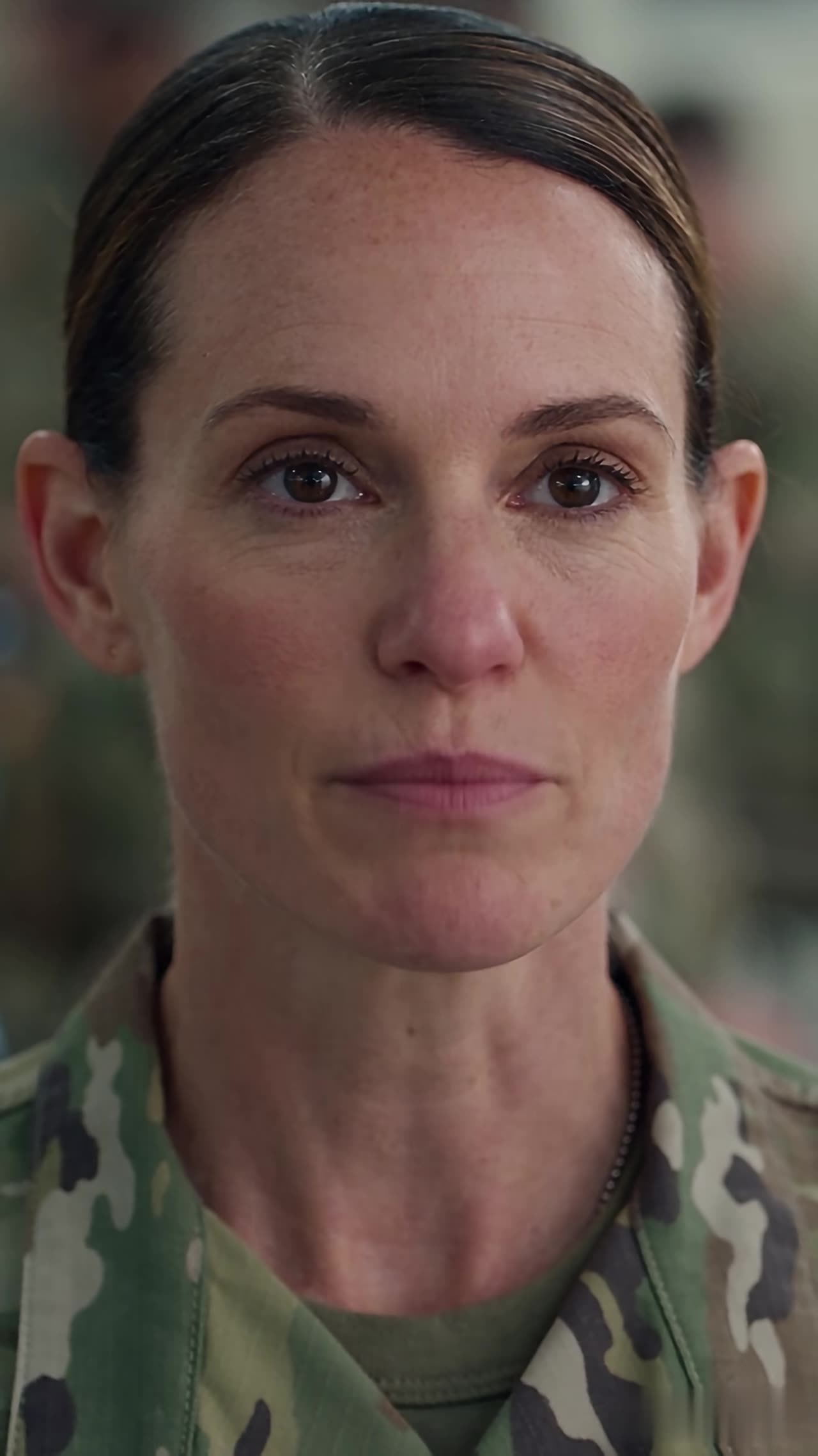 Close-up of colonel's cold fearless stare after reveal