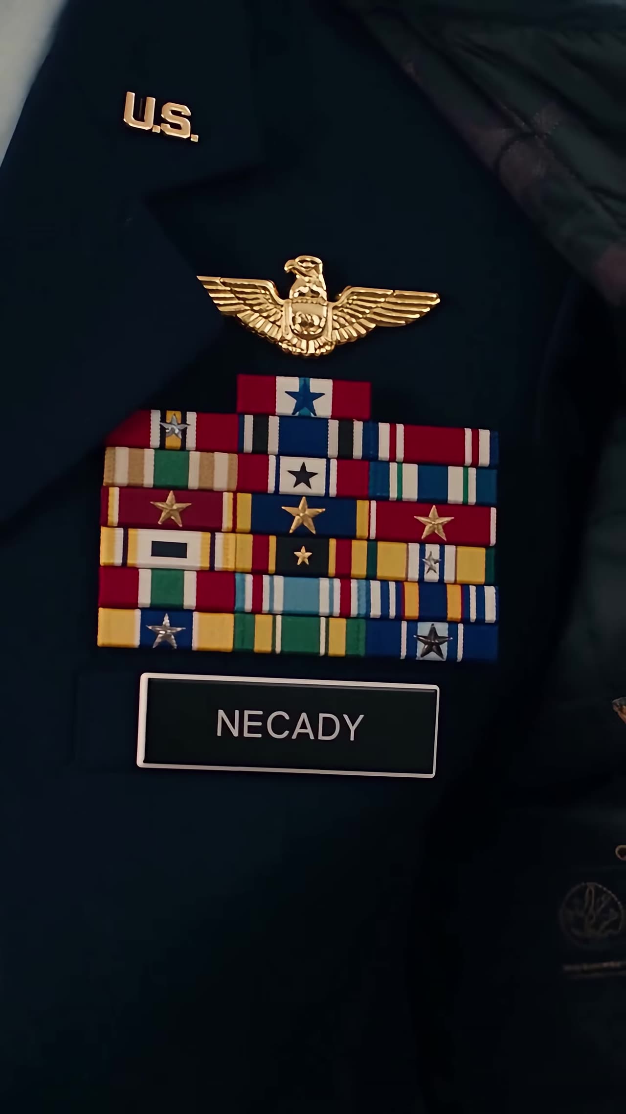 Close-up of medals, golden eagle and NECADY nameplate