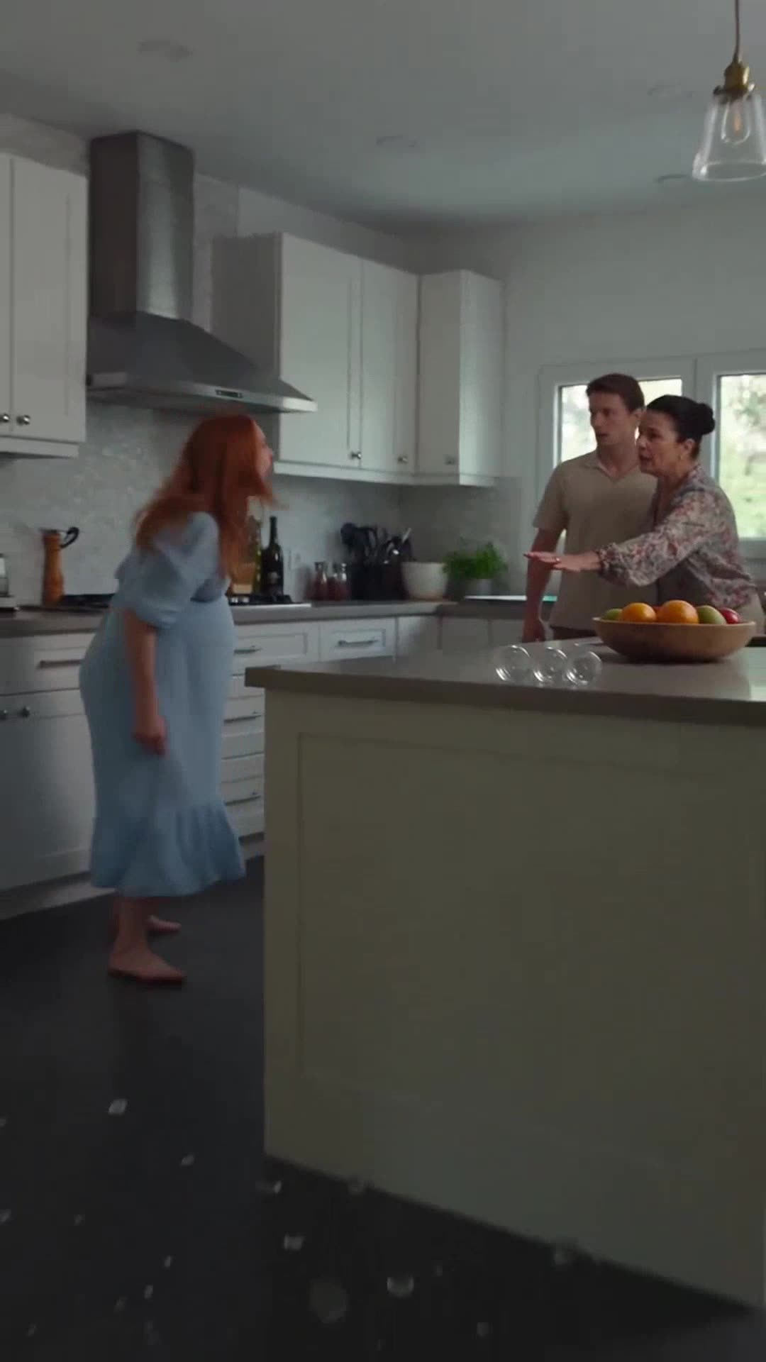 Camille recoils in fury across the kitchen island covered in shattered glass.