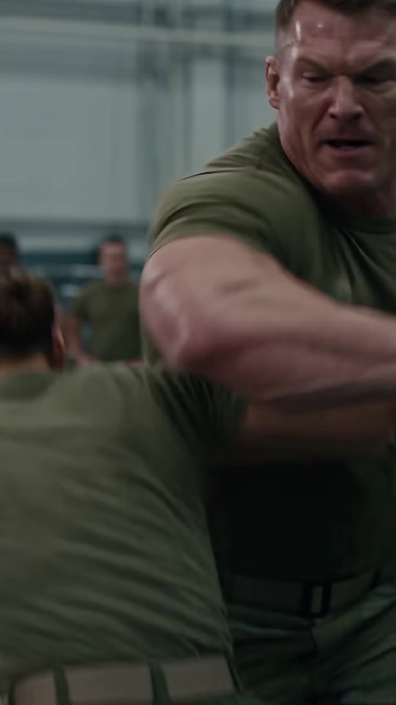 Close-up of soldier throwing powerful punch in fight