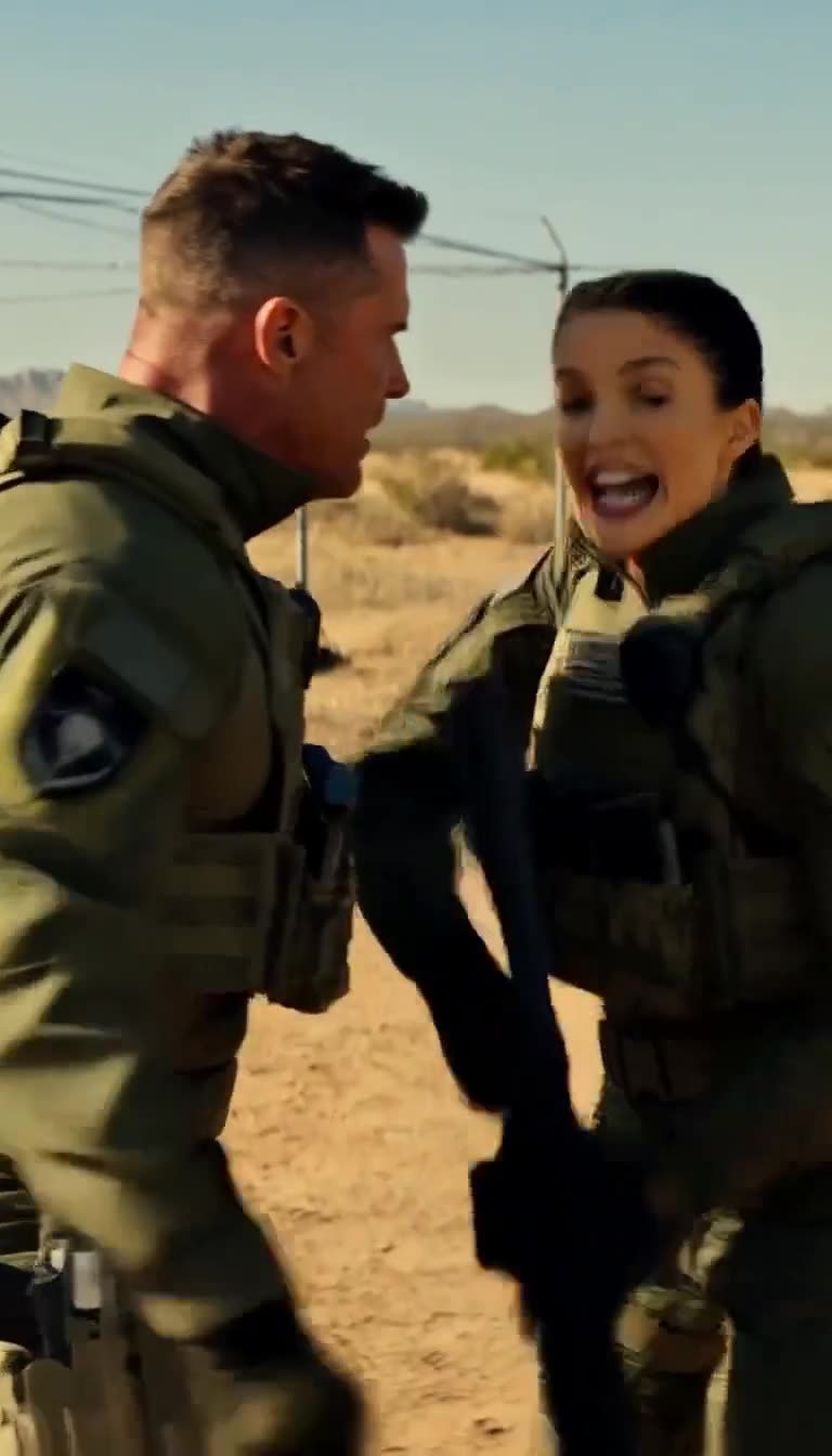 Close confrontation between the instructor and the woman in tactical gear, both speaking intensely on the range