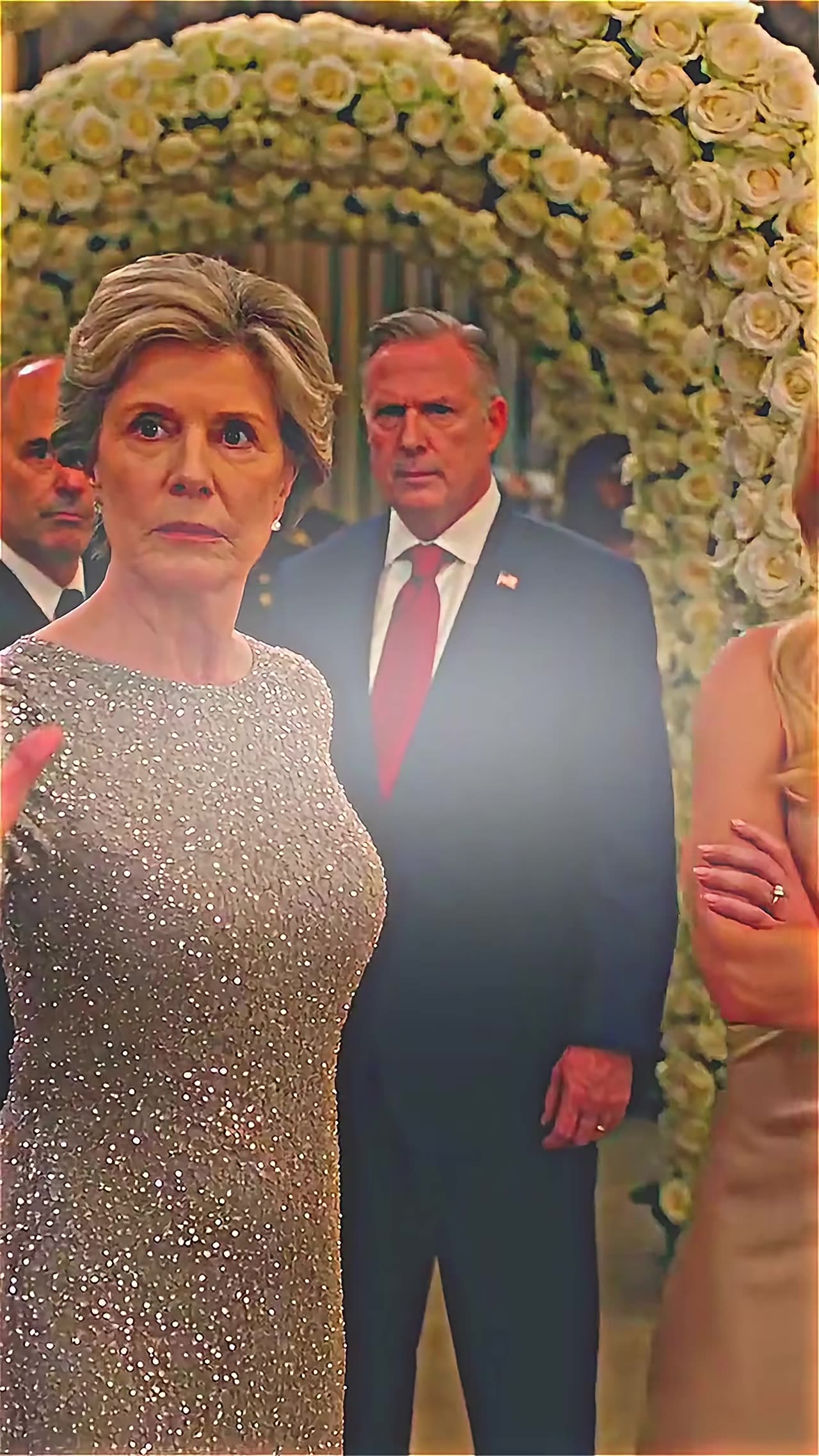 Shocked elite woman and stern suited man at gala