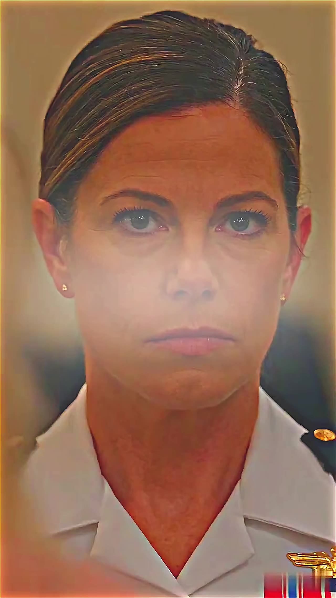 Close-up of resolute female officer in white uniform