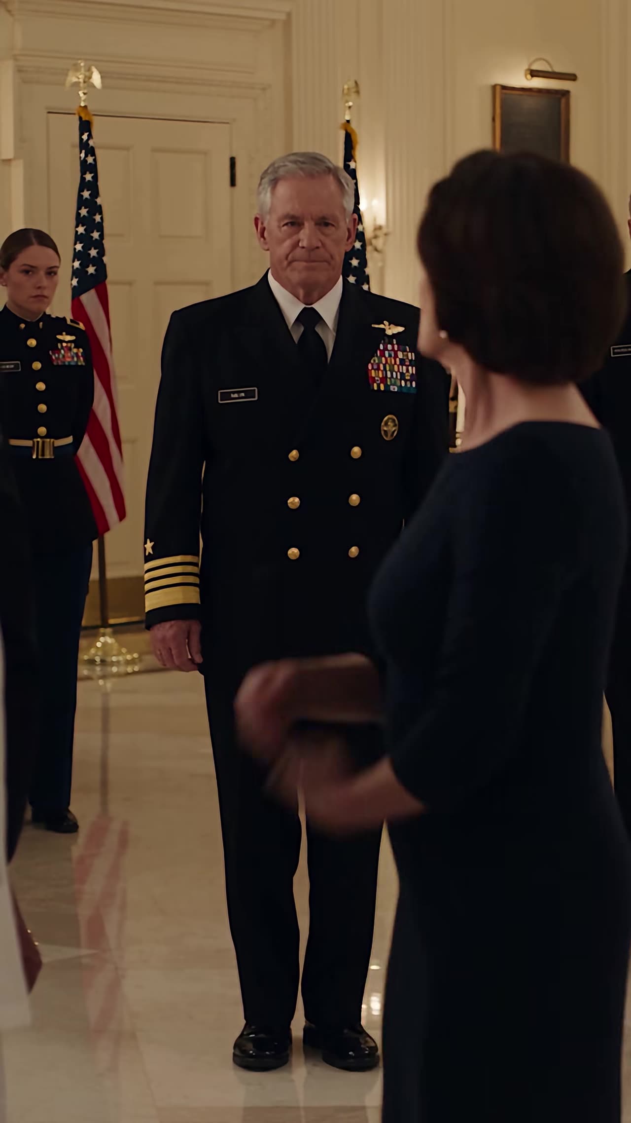 Four-star admiral confronts Catherine at flag-lined gala